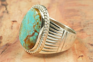 Genuine Manassa Turquoise set in Sterling Silver Ring. This Turquoise is also referred to as King�s Manassa Turquoise. The Manassa Turquoise mine is located in Manassa, Conejos County, Colorado. Created by Navajo Artist Phillip Sanchez. Signed. 
